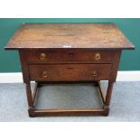 A late 17th century oak two drawer side table, on turned supports united by perimeter stretcher,