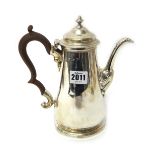 A silver teapot, 18th century, of tapering cylindrical form, with a replacement wooden handle,