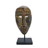 A Dan mask, Liberia, wood, 24cm high.