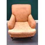 A Howard style easy armchair on turned supports, 85cm wide x 92cm high.