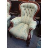 A pair of late William IV style mahogany framed spoon back armchairs, with reeded baluster supports,