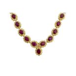 A gold, fracture filled ruby and diamond set oval cluster link necklace,