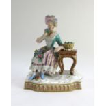 A Meissen porcelain figure, late 19th century, modelled with a seated lady and basket of flowers,