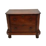 A diminutive early 19th century Dutch mahogany two drawer commode, on tapering square supports,