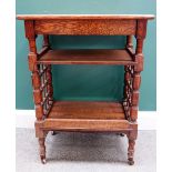 Attributed to Liberty; a late Victorian oak slope top small reading table,