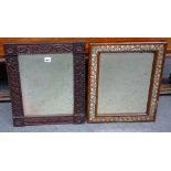 A small carved oak framed rectangular mirror, the beveled plate within floral carved surround,