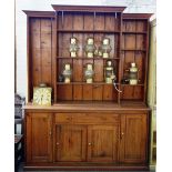 A 19th century pitch pine breakfront bookcase cupboard,