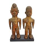 A pair of Lobi Bateba figures, Burkina Faso, wood, each 23cm high (2).