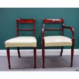 A set of fourteen George III style mahogany dining chairs,