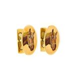 A pair of gold and enamelled cufflinks, the oval fronts enamelled with a horses head,