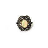 A gold and silver, opal and diamond set panel shaped ring,