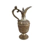 A Victorian silver Cellini pattern claret jug, decorated with classical masks and animals,