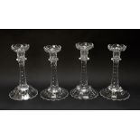 Four cut glass candlesticks, 20th century, with knopped facet cut steams, 22cm high.