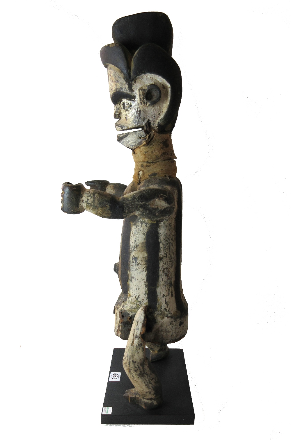 An Ogoni marionette figure, painted carved wood and cloth, on a later ebonised wooden plinth, - Image 2 of 2