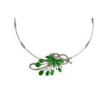 A white gold, cabochon, jade and diamond necklace, the front in an entwined and scrolling design,