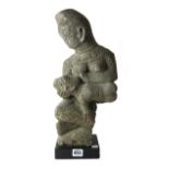 A Kongo stone fertility figure, modelled as a mother breast feeding a child,