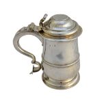 A silver hinge lidded tankard, mid 18th century, of baluster form,
