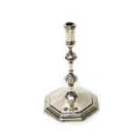 A late Victorian silver taperstick, of mid 18th century design, on an octagonal foot, height 11cm,