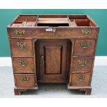 A George II mahogany knee hole dressing table, with fitted interior over cupboard and six drawers,