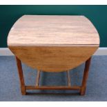 James Shoolbred; a late 19th century oak dropleaf breakfast table, white ivorine maker's disc,