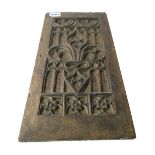 A 17th century French oak blind tracery panel, relief carved with fleurs de lis, 18cm wide x 37.