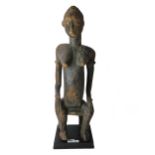 A Senufo seated female figure, wood, 58cm high, together with an Akan seated figure,