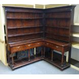 A mid-18th century oak corner dresser/ 'crooked dresser',