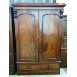 A Victorian mahogany two door wardrobe with single drawer base, 136cm wide x 203cm high.