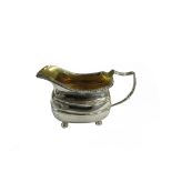 A George III silver milk jug, of curved rectangular form,