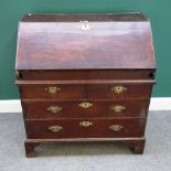 An early 18th century oak bureau,