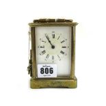 A French brass cased carriage clock, late 19th century, with foliate engraved case,