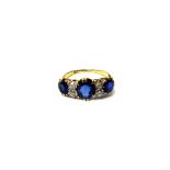 A gold, diamond, sapphire and synthetic sapphire ring,