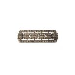 A diamond set brooch in a shaped rectangular panel shaped design,