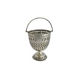 A silver sugar basket, having pierced decoration, raised on a pierced circular foot,