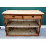 A 19th century pine dresser base, with pair of drawers over open shelves, 143cm wide x 99cm high.