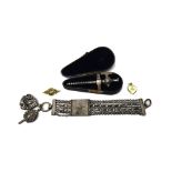 A multiple row fob chain fitted with a pendant watch key and a fob and having a central panel with