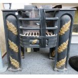 A pair of Victorian cast iron fire grates, with three bar front, flanked by fluted pillars,
