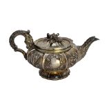 A George IV silver teapot, of compressed circular form,