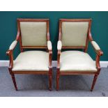 A pair of Louis XVI style beech framed square back open armchairs, on tapering fluted supports,