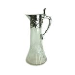 An Art Nouveau cut glass claret jug with silver plated mount, circa 1900,