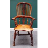 A mid-19th century yew back Windsor chair, with Christmas tree pierced splat, on turned supports,