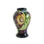 A Moorcroft pottery vase, 'Queens Choice' pattern, circa 2000,