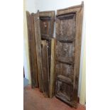 A 19th century Moorish metal mounted hardwood double door, each with four panel decoration,