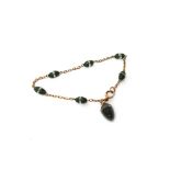 A gold and nephrite bracelet,