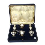 A silver six piece condiment set, comprising; two mustard pots, two pepperettes and two salts,