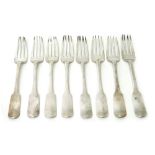 Eight Scottish silver fiddle pattern table forks, probably Edinburgh, each crest and motto engraved,