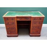 A Victorian mahogany kneehole writing desk, with nine drawers about the knee,