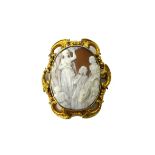 A Victorian gold mounted oval shell cameo brooch, carved as The Flight into Egypt,