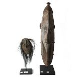 A Pora Pora/Keram pig bone mask, Papua New Guinea, wood and feathers, 29cm high,