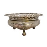 A silver shaped circular bowl,